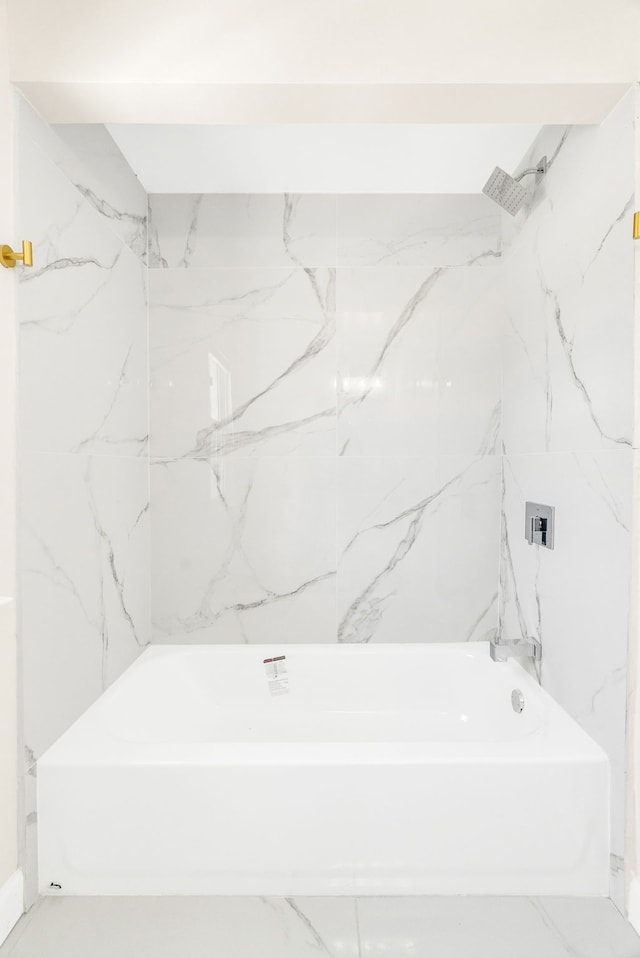 full bathroom featuring marble finish floor and shower / washtub combination