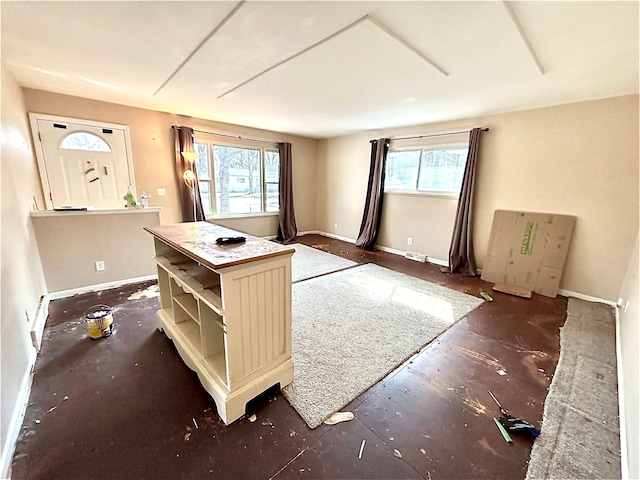 interior space featuring open shelves and baseboards