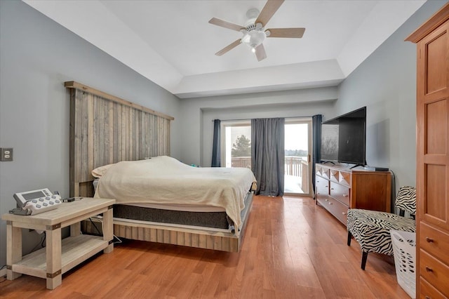 3912 Alex Ct, Oxford, MI 48371 - bedroom featuring access to outside, light wood finished floors, a raised ceiling, and a ceiling fan