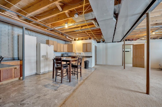 3912 Alex Ct, Oxford, MI 48371 - unfinished below grade area featuring white fridge with ice dispenser