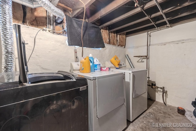 laundry area with washing machine and dryer and laundry area