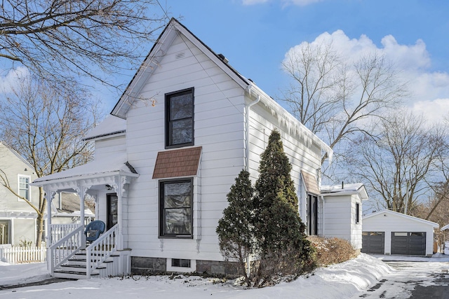 view of front of property with an outbuilding and a garage