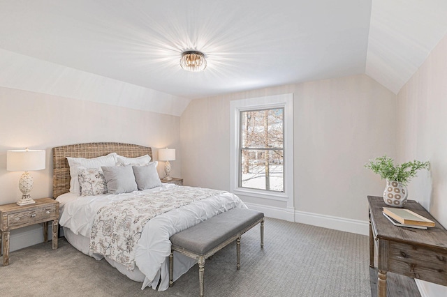 bedroom featuring lofted ceiling, light colored carpet, and baseboards