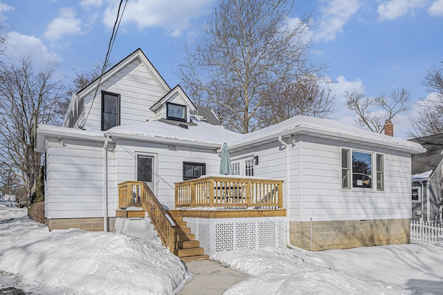 view of front of property with stairs and a wooden deck