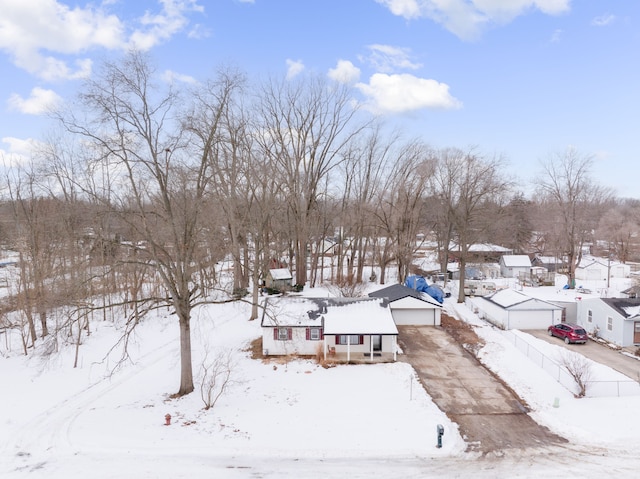 snowy aerial view with a residential view