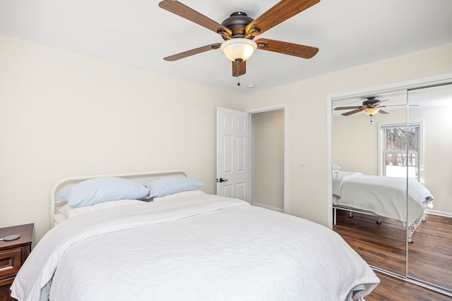 bedroom with a ceiling fan, a closet, baseboards, and wood finished floors