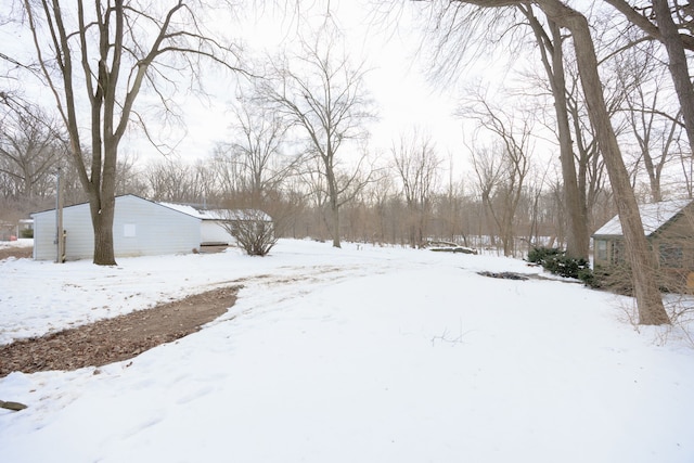 view of yard layered in snow