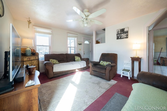 living room with dark colored carpet and ceiling fan