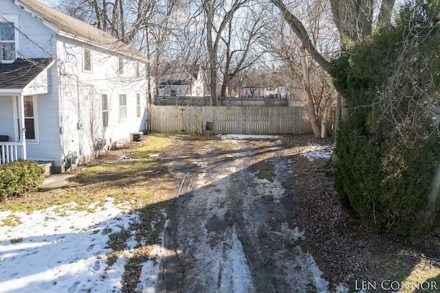 view of yard featuring cooling unit and fence