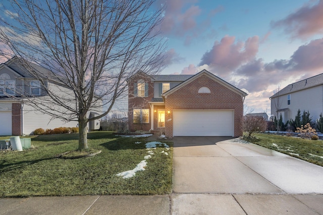 traditional-style house featuring driveway, an attached garage, a front lawn, and brick siding