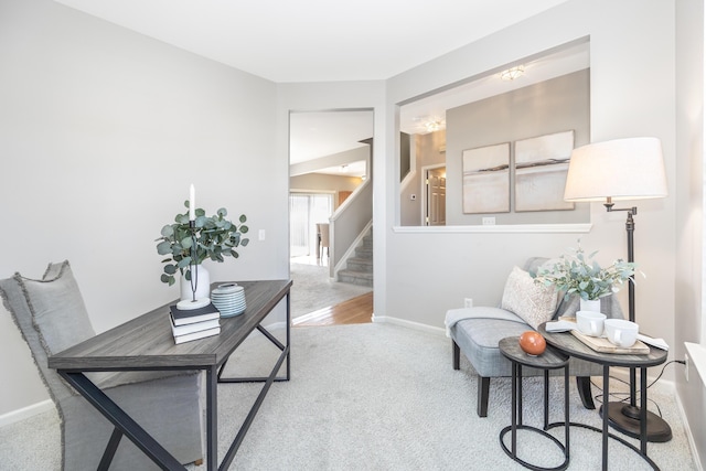 carpeted office featuring baseboards