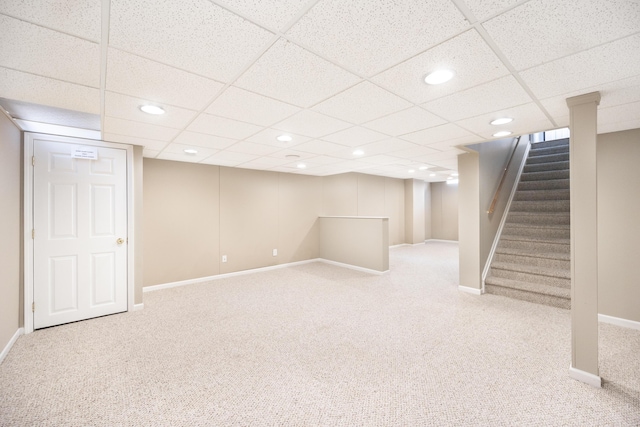 finished below grade area featuring stairs, carpet, baseboards, and recessed lighting