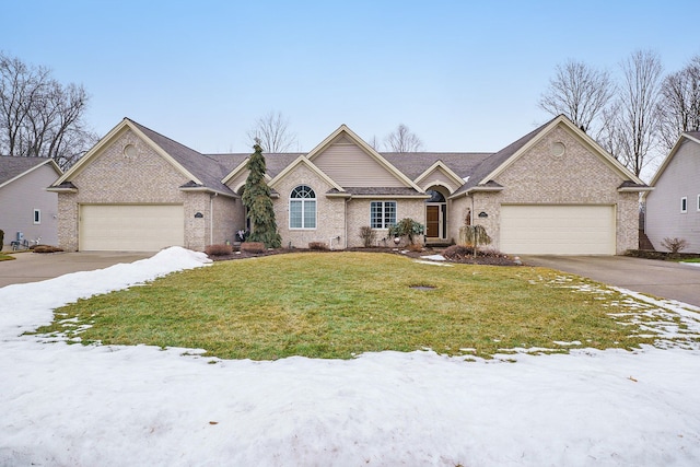 view of front of house featuring brick siding, driveway, an attached garage, and a lawn