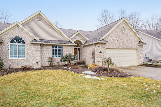 ranch-style house with a garage, a shingled roof, concrete driveway, a front lawn, and brick siding