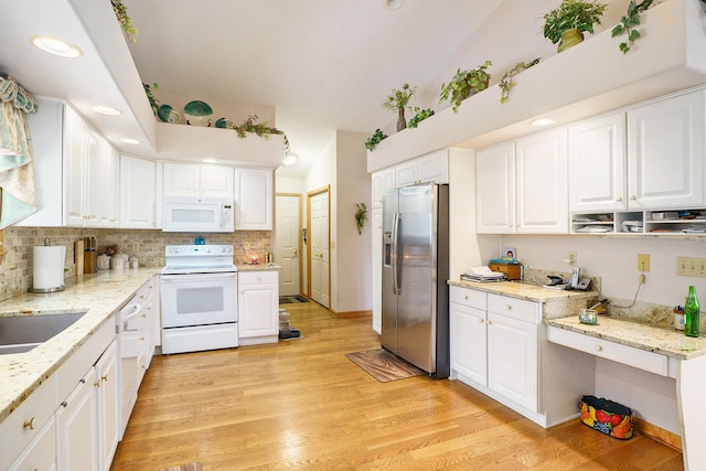 kitchen featuring white appliances, backsplash, white cabinets, and light wood-style floors