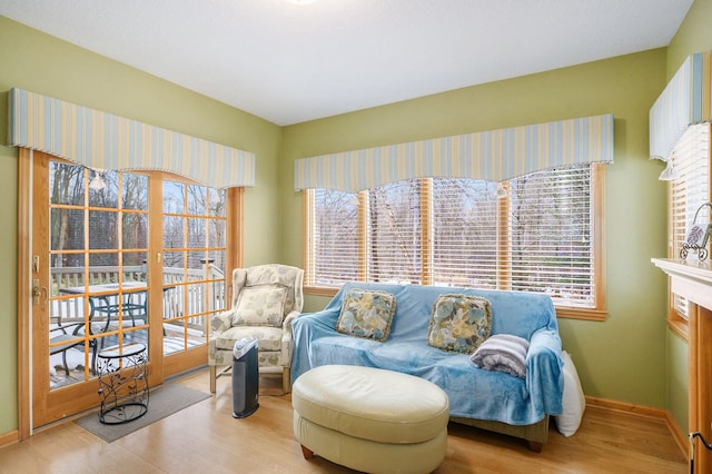 sitting room with light wood-style floors and baseboards