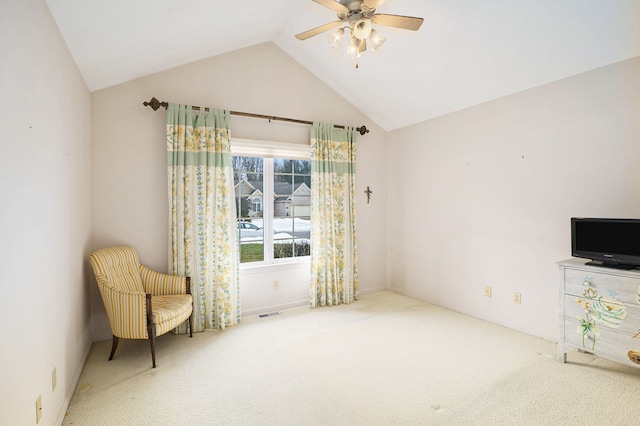 sitting room with lofted ceiling, baseboards, a ceiling fan, and carpet flooring