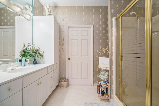 full bath featuring a stall shower, tile patterned flooring, vanity, and wallpapered walls