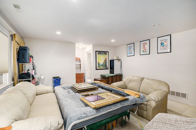 living room with carpet, visible vents, and recessed lighting