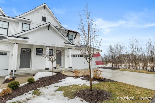 view of front of house featuring a garage, concrete driveway, and board and batten siding