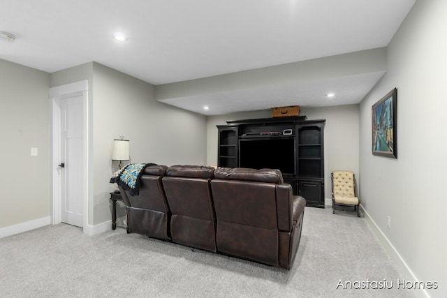 living area with baseboards, recessed lighting, and light colored carpet