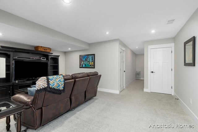 living room featuring light colored carpet, visible vents, baseboards, and recessed lighting