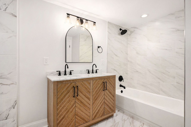 full bathroom featuring double vanity, marble finish floor, bathtub / shower combination, and a sink