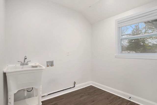 laundry room with laundry area, dark wood-type flooring, hookup for a washing machine, and baseboards