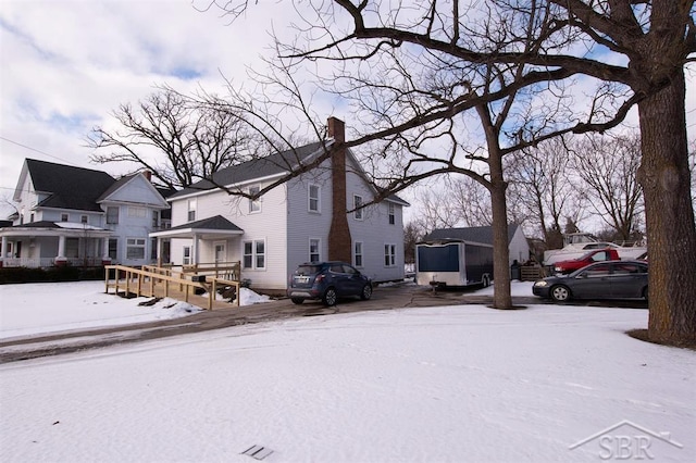 exterior space with a chimney and a residential view