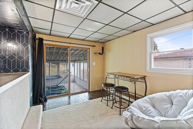 interior space featuring a paneled ceiling and visible vents