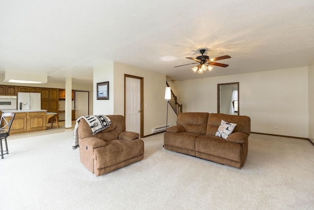 living room featuring baseboards, light colored carpet, stairway, and baseboard heating