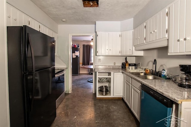 kitchen with stainless steel appliances, a ceiling fan, white cabinetry, a sink, and a textured ceiling