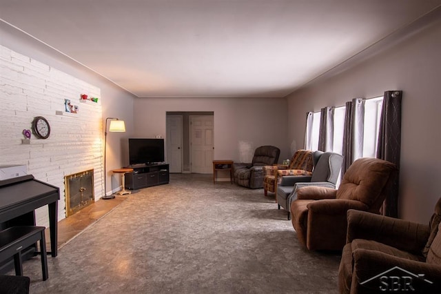 living room featuring a brick fireplace