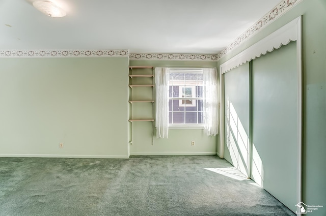 unfurnished room with light carpet and baseboards