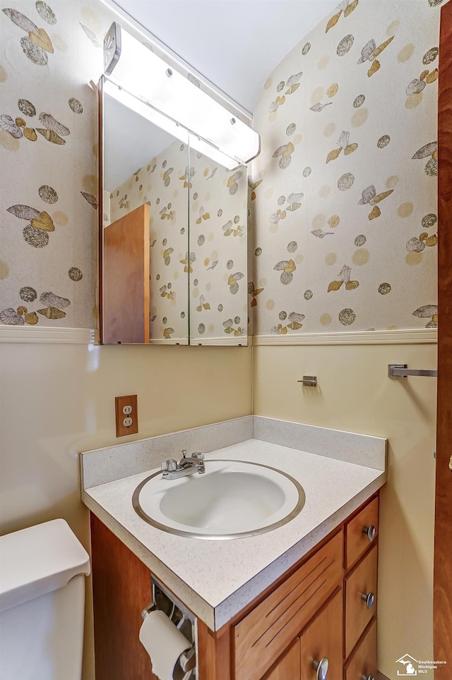 bathroom with vanity and toilet