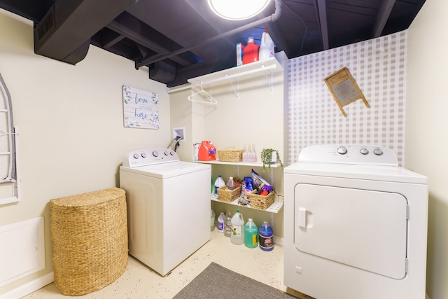 laundry area with independent washer and dryer