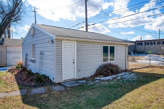 view of outbuilding with an outdoor structure and fence