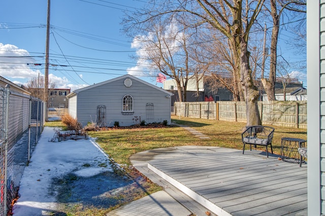 exterior space featuring fence, an outdoor structure, and a wooden deck