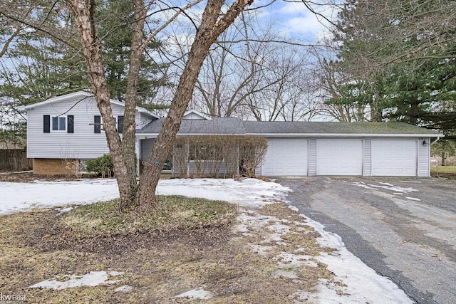 view of front facade with driveway and an attached garage