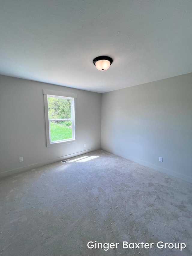 1910 Fallasburg Park Dr NE Unit 5, Lowell, MI 49331 - carpeted empty room featuring baseboards