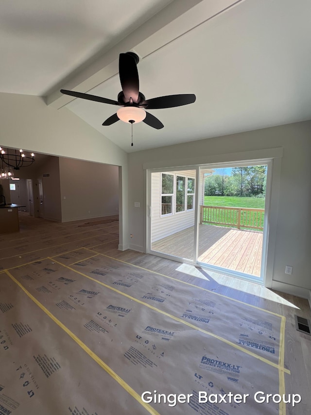 1910 Fallasburg Park Dr NE Unit 5, Lowell, MI 49331 - unfurnished living room with a chandelier, wood finished floors, a ceiling fan, and baseboards