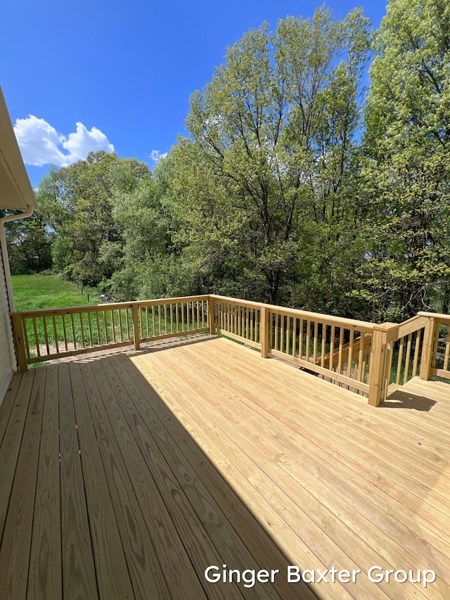 1910 Fallasburg Park Dr NE Unit 5, Lowell, MI 49331 - wooden terrace with view of wooded area