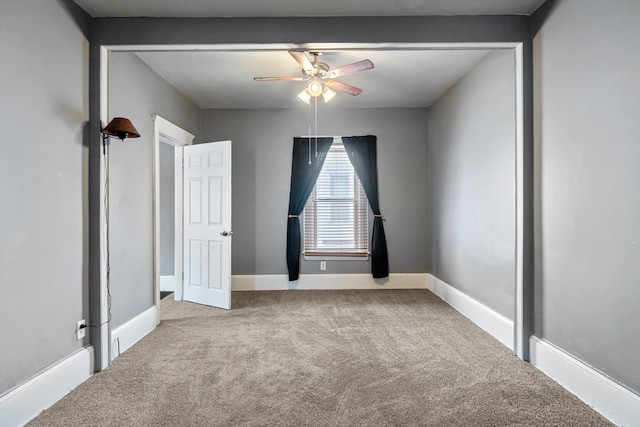 unfurnished bedroom featuring carpet floors, ceiling fan, and baseboards