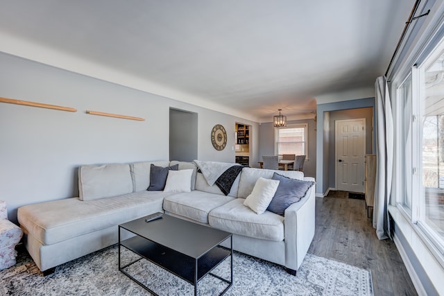 living room with baseboards and wood finished floors