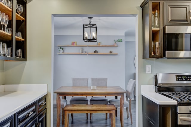 dining space featuring a notable chandelier and wood finished floors