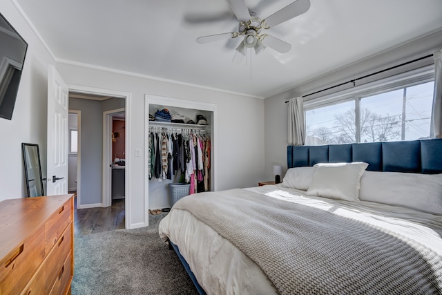 carpeted bedroom with ornamental molding, a closet, ceiling fan, and baseboards