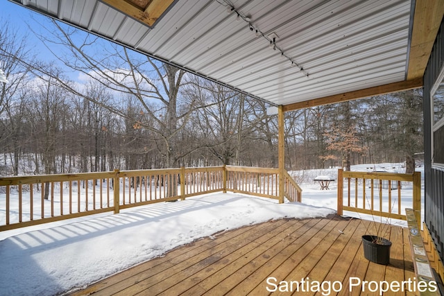 view of snow covered deck