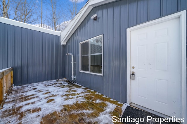 view of snow covered property entrance