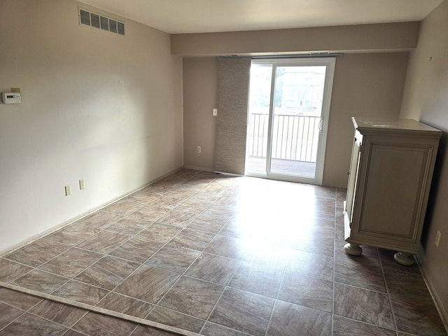 unfurnished living room with visible vents