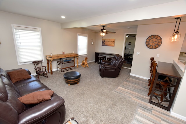 living area featuring carpet floors, recessed lighting, a ceiling fan, and baseboards